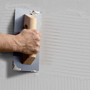 1. Spread a coat of adhesive-based cement across the surface, ensuring that it is flat and even.